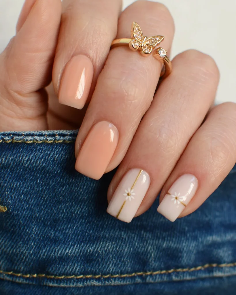 Charming-Nude-Nails-with-Floral-Embellishments.webp
