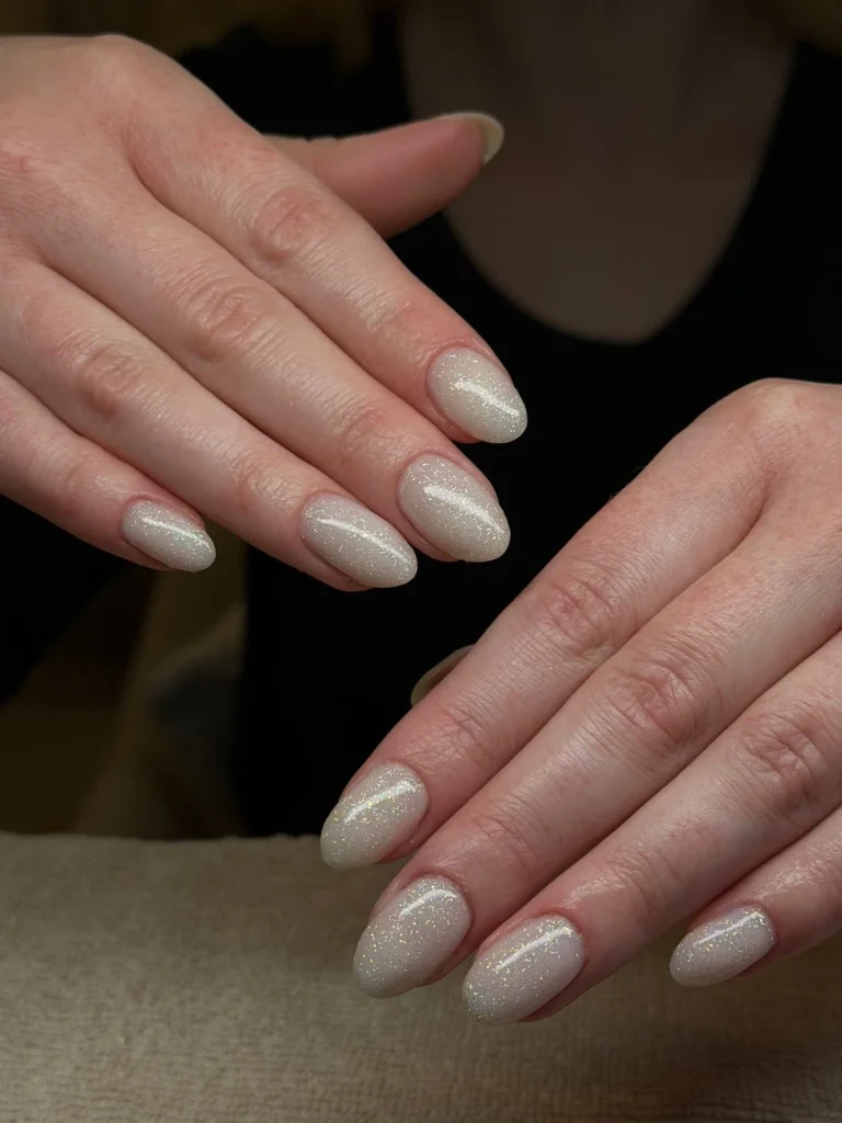Milky-Nude-Shimmer-Almond-Nails.webp

