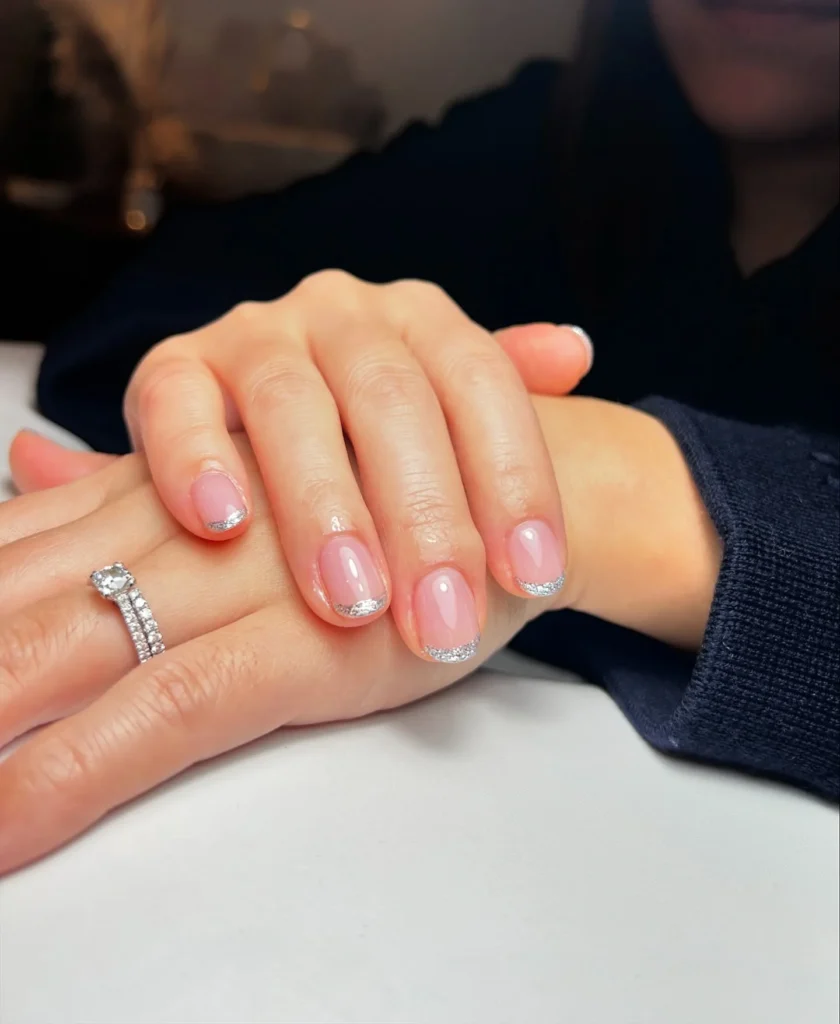 Natural-Pink-Nude-Nails-with-Silver-Glitter-French-Tips.webp
