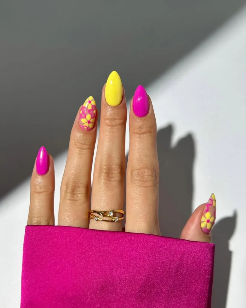 Bold-Pink-and-Yellow-Flower-Nails.webp