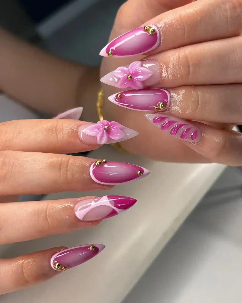Floral-Gradient-Pink-Nails-with-Gold-Accents.webp
