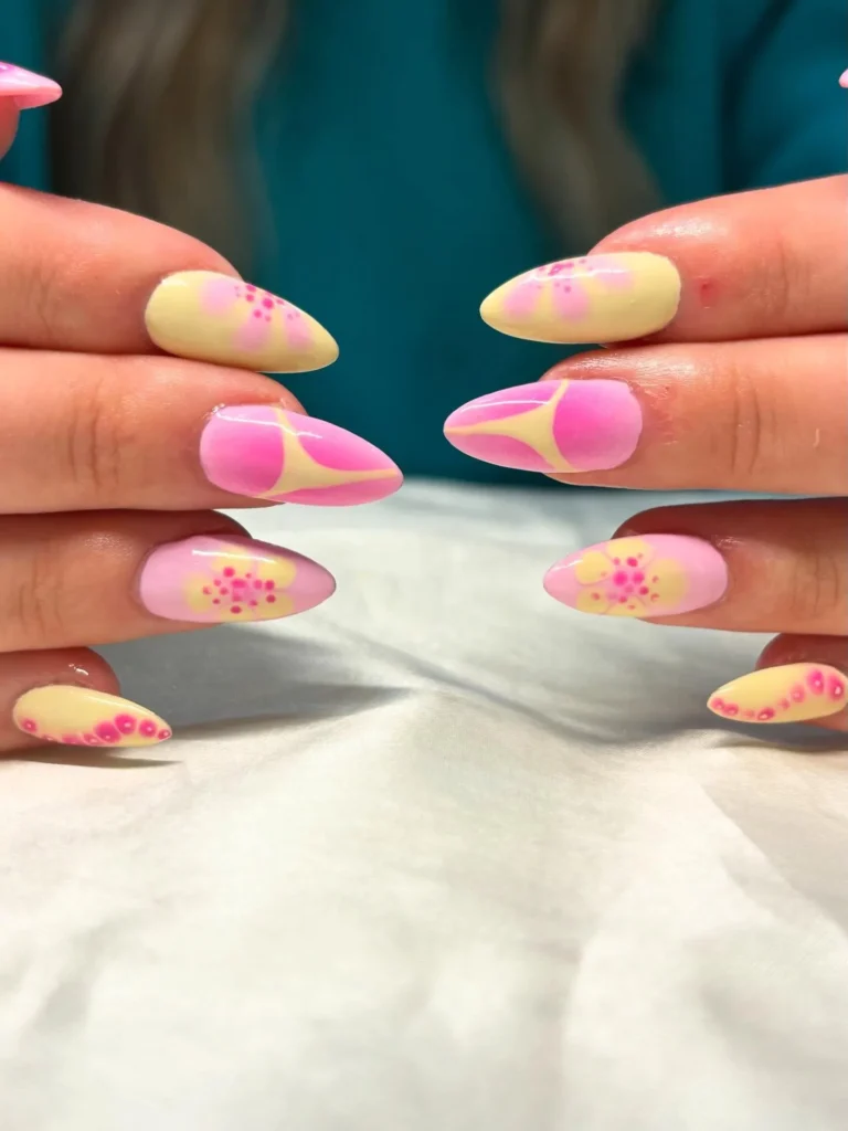 Pink-and-Yellow-Abstract-Flower-Nails.webp