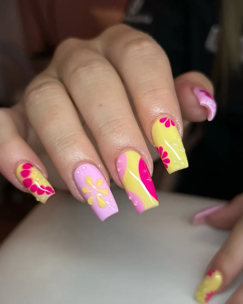 Pink-and-Yellow-Flower-Power-Nails.webp